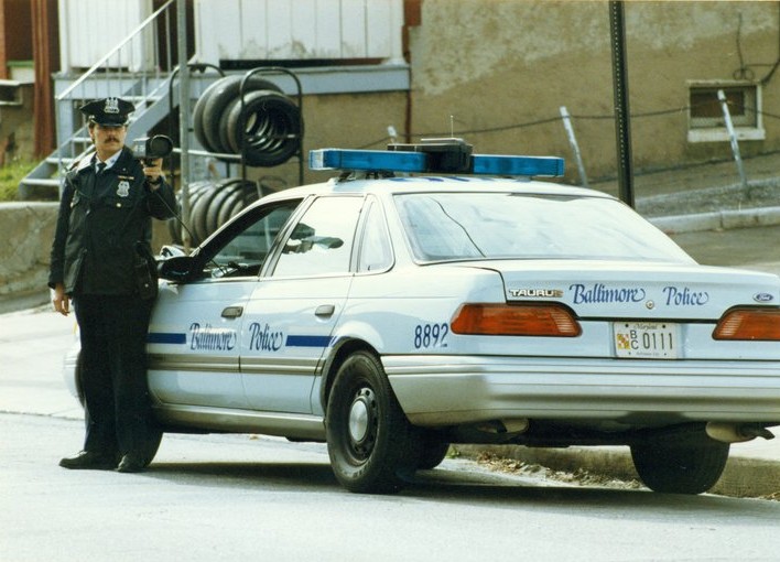 light blue Ford Taurus