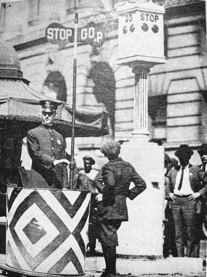New electric traffic sign next to a manual one October 1923 St Paul and Fayette